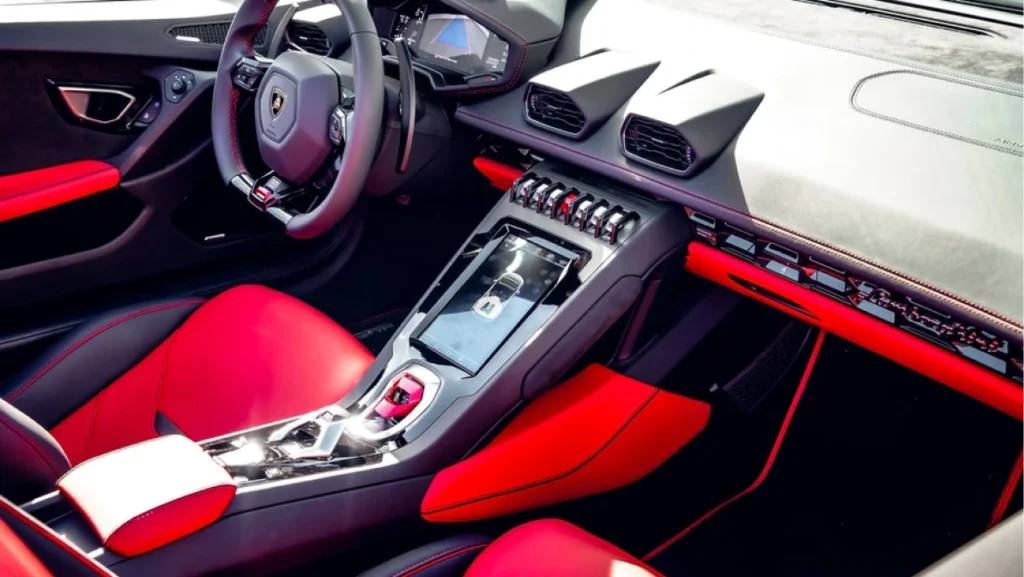 A Lamborghini luxury car interior featuring red and black leather seats
