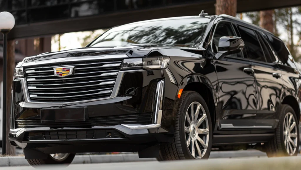 A black Cadillac Escalade luxury car parked outdoors